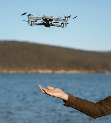side-view-hand-drone-outdoors_23-2149392705